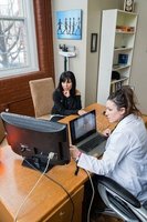 Gallery Photo of Anna Marie Blessing doing Biofeedback with a client