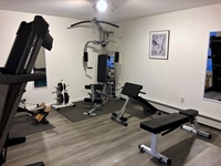 Gallery Photo of Old Saybrook, CT office gym area for teaching weight training form, techniques, and education.