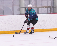 Gallery Photo of Dr. Reed playing hockey