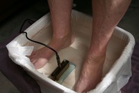 Gallery Photo of A photo of an ionic foot bath detox in session